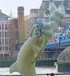 Photograph statue dolphin and girl   London  Tower Bridge